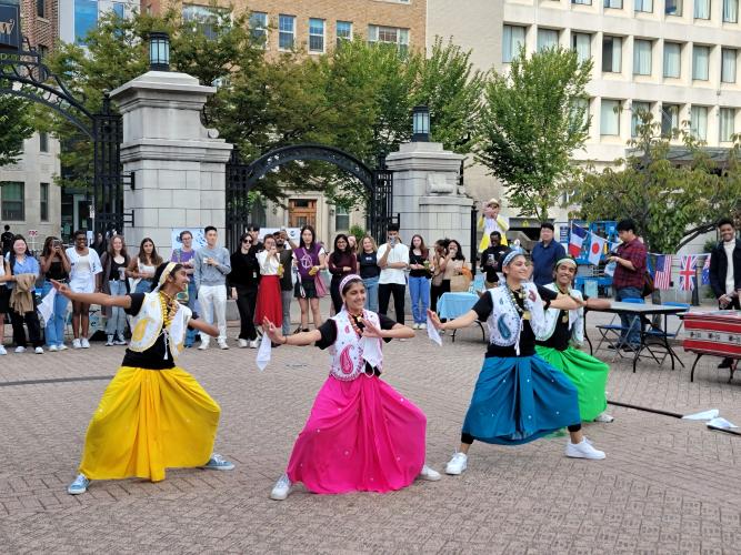 Students Dancing in Colorful Skirts