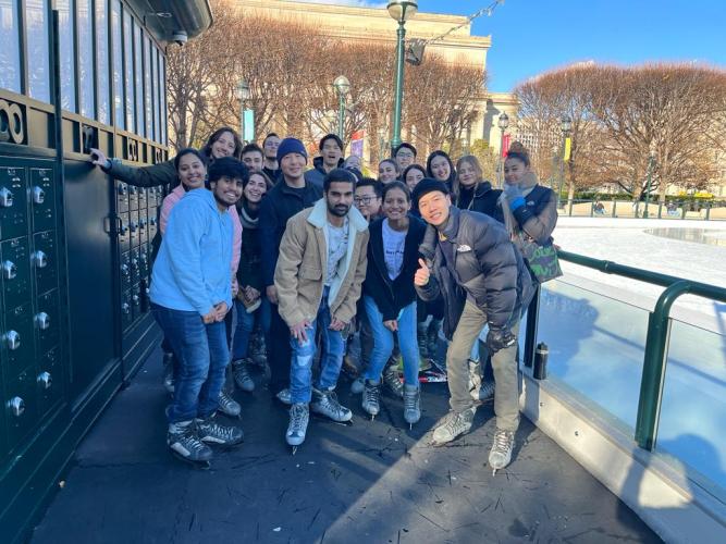 Students in Ice Skates next to a Skating Rink