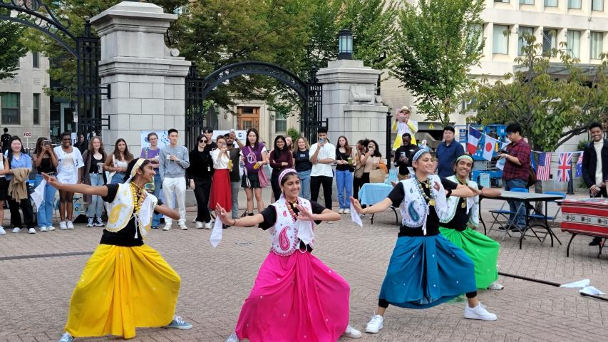 Students Dancing in Colorful Skirts